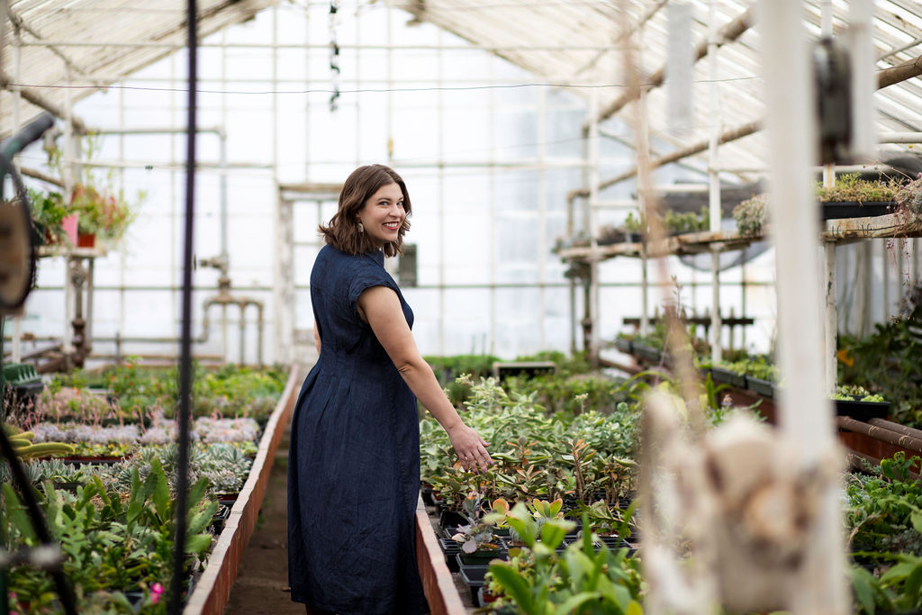 Artist Hannah VanDuinen in a greenhouse in Plymouth, MI